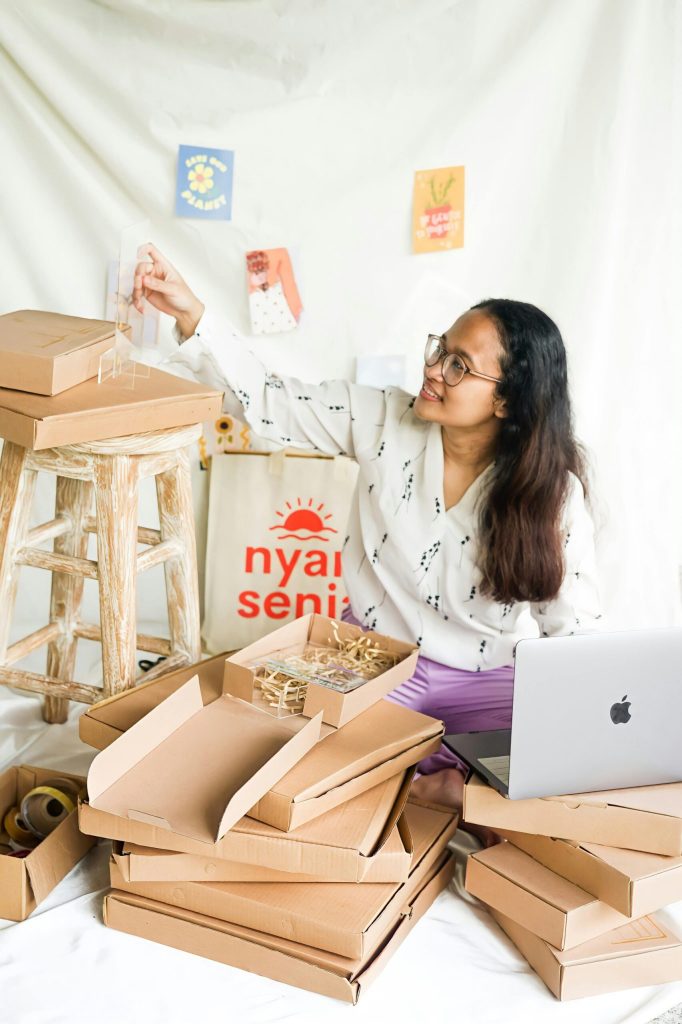 Woman smiling and unpacking supplies to support her purpose