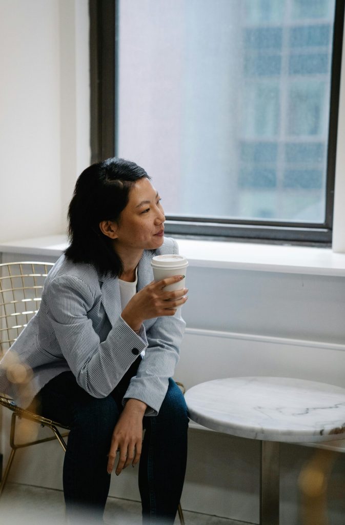 woman thinking with a coffee